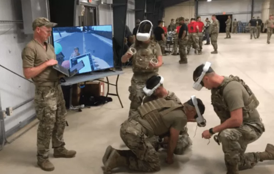 A group of soldiers wearing virtual reality and doing a simulation training.