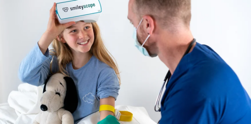 What You Should Know: - Smileyscope™, a pioneer in virtual reality (VR) therapeutic solutions, has received Class II clearance from the U.S. Food and Drug Administration (FDA) for its Smileyscope™ Therapy system. - The FDA clearance marks Smileyscope as the first and only VR Analgesic™ available in the US. Digital Therapeutics Leadership Smileyscope's FDA clearance underscores its leadership in Digital Therapeutics, a category defined as delivering medical interventions directly to patients through evidence-based, clinically evaluated software. The Digital Therapeutics market is projected to reach 32.5 billion USD by 2030. Procedural Choreography™ Patent The FDA clearance included an evaluation of Smileyscope's patented Procedural Choreography™ technique, a proprietary method that replaces negative real-world stimuli (e.g., a needle) with positive virtual stimuli (e.g., a friendly fish). This technique enhances safety and efficacy and serves as the foundation for future therapeutic products. Clinical Trials Smileyscope's studies, the world's largest randomized trials in procedural VR, demonstrated significant reductions in child self-rated pain (up to 60%) and anxiety (up to 40%). The trials also showed benefits in caregiver distress (up to 75%) and a reduction in the use of physical restraints (up to 48%). Future Expansion Smileyscope aims to build on this success with a robust pipeline of drug-free pain and anxiety management treatments for common medical procedures across age groups. The company envisions widespread adoption in hospitals, doctor's offices, and an expanded range of patients benefiting from their drug-free treatments. "We were thrilled to receive this FDA Class II clearance. The FDA affirms Smileyscope's long-held position that we are a transformational, therapeutic VR device, raising the standard of care," said Dr. Evelyn Chan, CEO and co-founder of Smileyscope.